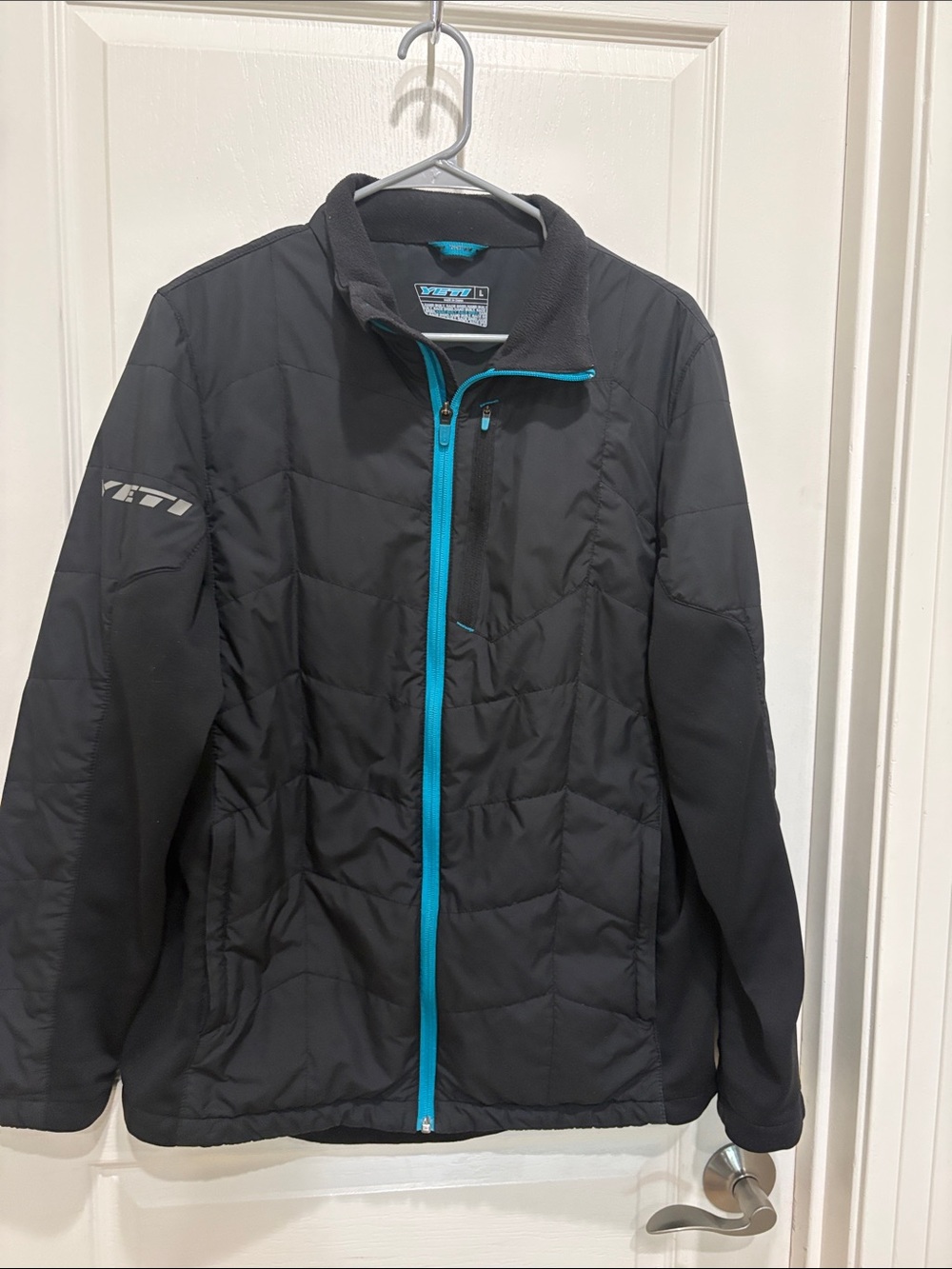 Yeti Black Puffer Jacket with Teal Zipper